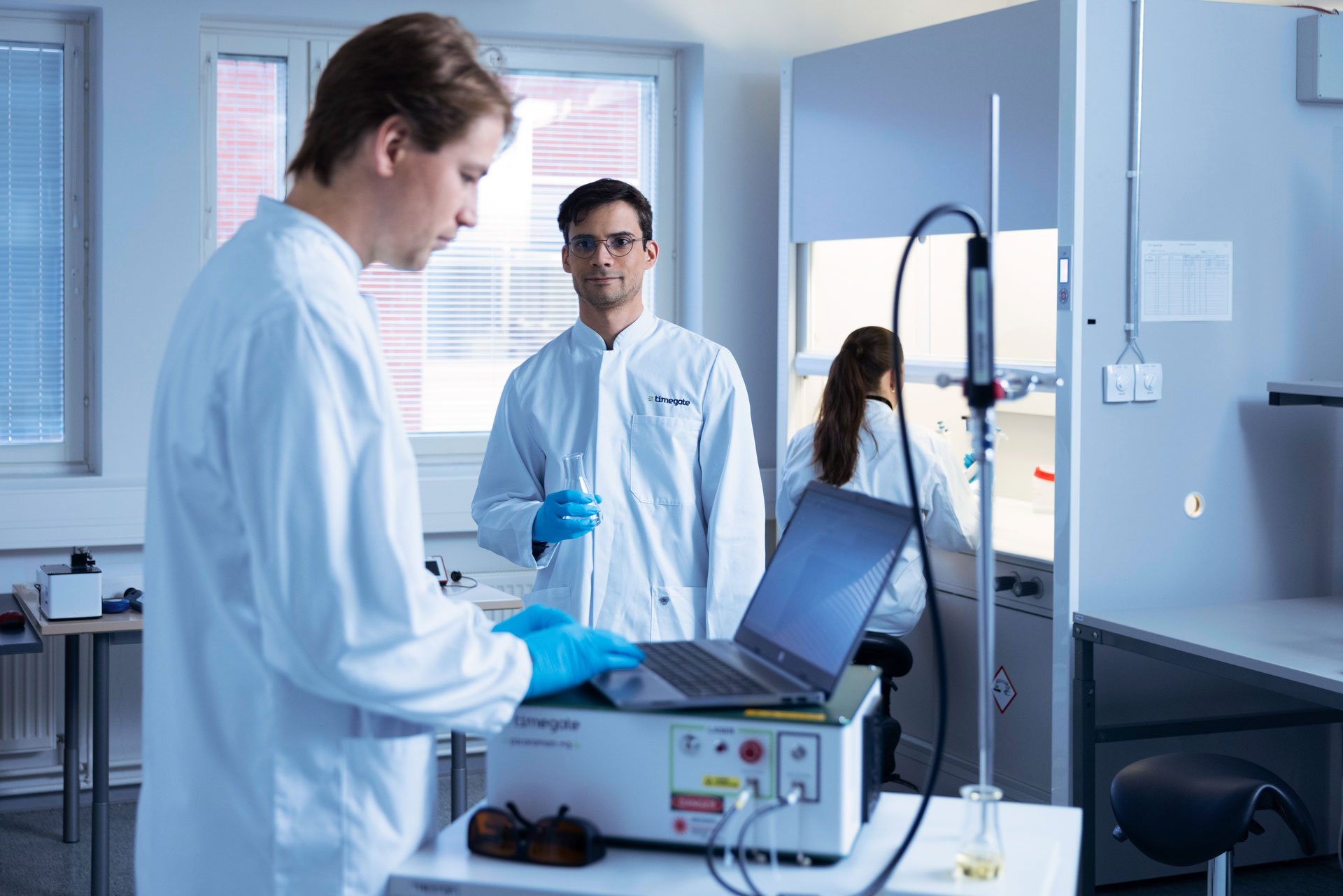 three-people-in-laboratory-working