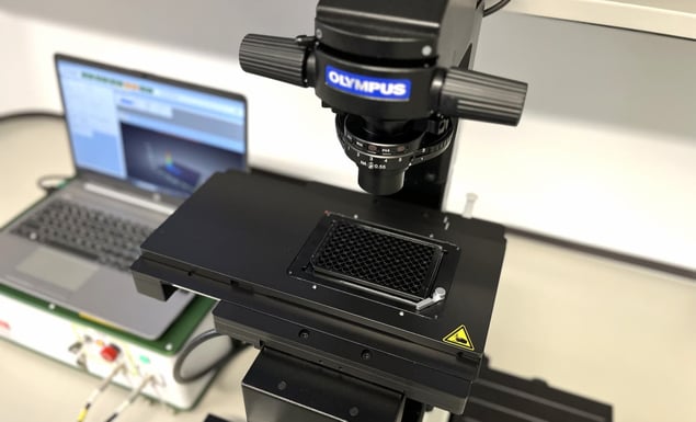 MicroPlate HTS System integrated into Olympus IX73 microscope.
