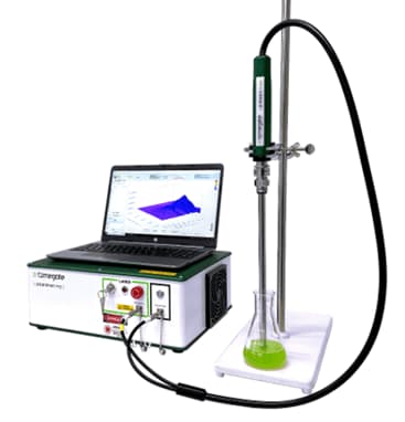 Probe measuring liquid that shows in a laptop which is on top of a device.