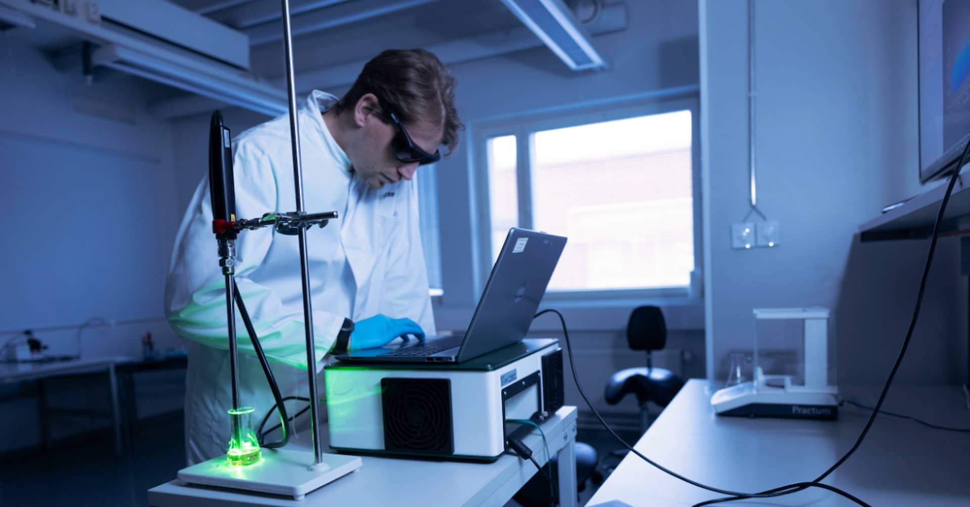 Operator using Timegated® Raman spectrometer with green laser on.